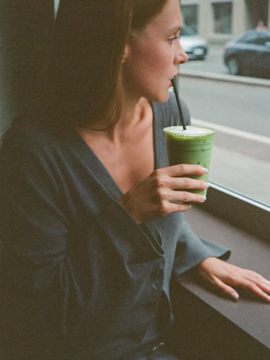 A customer enjoying a drink by the window