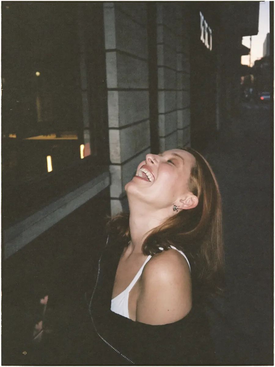 A customer laughing on a night out